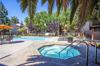 our apartments have a swimming pool and a patio with umbrellas at Valley Plaza Villages, Pleasanton, 94566